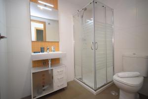 a bathroom with a shower and a toilet and a sink at Edimar 9 - Fincas Arena in Benidorm +87 photos