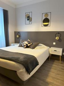 a bedroom with a large bed with a black blanket at Dolce Vita in Mondorf-les-Bains