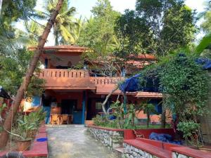 a house in the middle of a forest at Neela House in Kovalam