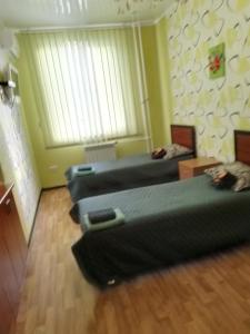 Кровать или кровати в номере SunLake Hotel Osokorki