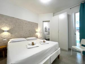 Postel nebo postele na pokoji v ubytování Angolo Mare Apartments & Rooms