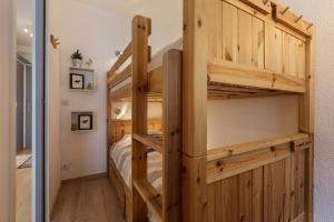 a bunk bed in a tiny house at Les Marmottes En Chaussettes - Happy Rentals in Chamonix-Mont-Blanc