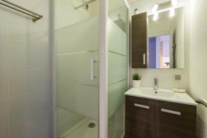a bathroom with a sink and a shower at Les Marmottes En Chaussettes - Happy Rentals in Chamonix-Mont-Blanc +18 photos