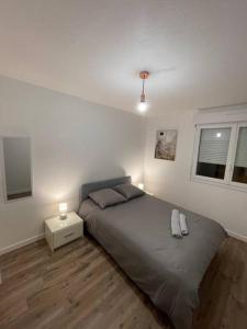 Katil atau katil-katil dalam bilik di Appartement Cosy à Cenon, proche transports