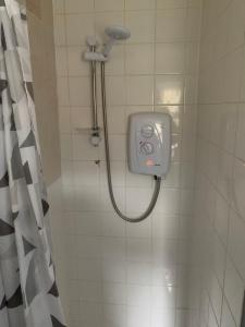 a shower in a bathroom with a shower at 1 bed fully furnished Walsall property in Walsall