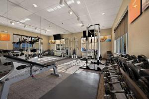 a gym with treadmills and machines in a room at Comfort Inn & Suites Airport Convention Center in Reno
