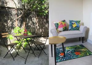 a living room with a chair and a table at Studio avec cour extérieure aux portes de Paris in Bagnolet