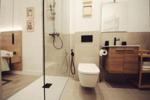 a bathroom with a toilet and a shower at The Park House II by homebilbao. in Bilbao