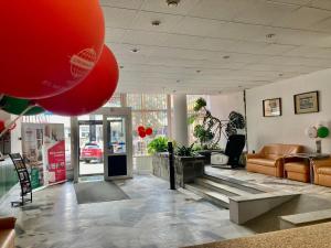 a lobby of a store with a red balloon at Hotel Gromada Zakopane in Zakopane