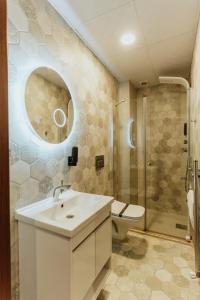 a bathroom with a sink and a toilet and a shower at Concept Royal Edirne in Edirne