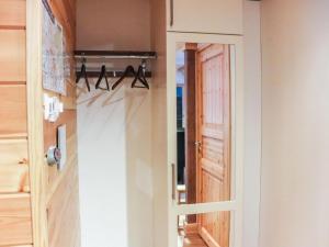 an open door in a room with a closet at Holiday Home Lampitaival 6b by Interhome in Kotila