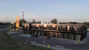 an overhead view of a building in a parking lot at Väo Keskus Modern Guest Apartments in Tallinn
