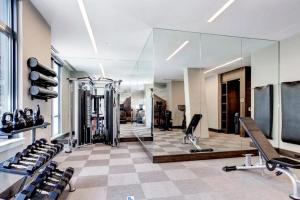 a room with a gym with a large glass wall at Bethesda 1br w gym concierge nr metro station WDC-807 in Bethesda