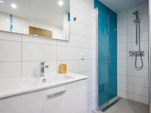 a bathroom with a sink and a shower at Apartment U Dzina-2 by Interhome in Polubný