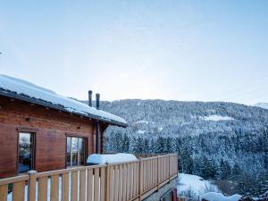 a log cabin with snow on the roof at Chalet Chalet les Pars by Interhome in Gryon