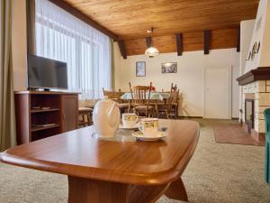 a living room with a wooden table and a dining room at Villa Svoboda nad Úpou by Interhome in Svoboda nad Úpou