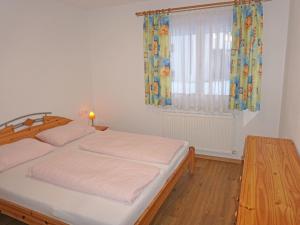 Ένα ή περισσότερα κρεβάτια σε δωμάτιο στο Apartment Apart Dawin by Interhome