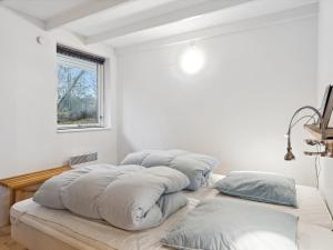 En eller flere senge i et værelse på Holiday Home Guri - 600m to the inlet in The Liim Fiord by Interhome