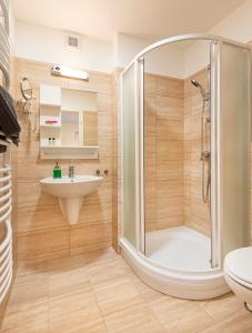 a bathroom with a shower and a sink at Kostel Panzió in Kesztölc +36 photos
