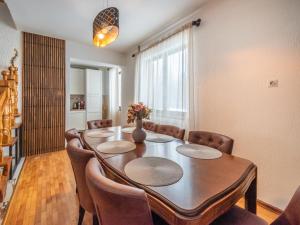 a dining room with a table and chairs at Holiday Home Gorski Hedon by Interhome in Čabar