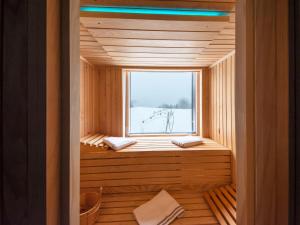 a sauna with a window in a wooden house at Holiday Home Gorski Hedon by Interhome in Čabar
