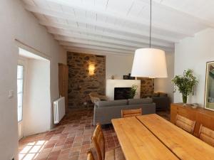 a living room with a table and a couch at Holiday Home La Dolce Vita Brezhoneg by Interhome in Trémeven +37 photos