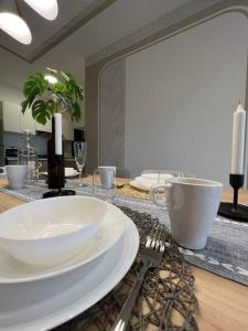 a table with a plate and fork and a mirror at Idyllic Cottage 3BR Desa Park City Mont Kiara in Kuala Lumpur +26 photos
