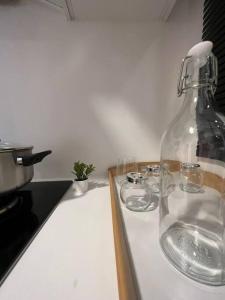 a glass bottle sitting on top of a kitchen counter at Idyllic Cottage 3BR Desa Park City Mont Kiara in Kuala Lumpur