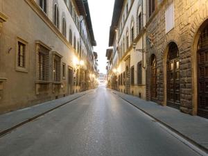 an empty street in the middle of an alley at Apartment Bellevue Palazzo Pitti by Interhome in Florence