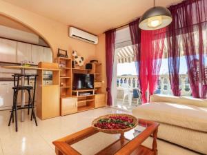 a living room with a couch and a table at Apartment Miami Dorada II by Interhome in Miami Platja