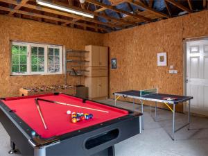 a room with a pool table and ping pong ball at 5 Bed in Bwlch BN318 in Bwlch