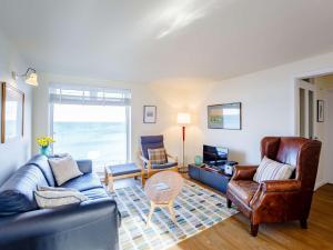 a living room with a couch and a table at 2 Bed in Berwick-upon-Tweed 82189 in Spittal