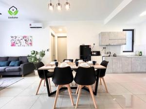 a dining room with a table and chairs in a kitchen at IOI City Mall Modern Home PICC in Putrajaya
