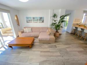 a living room with a couch and a coffee table at Medano Beach - Villa Playa in El Médano