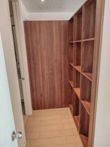 a room with a closet with wooden shelves at Departamento en Calama in Calama