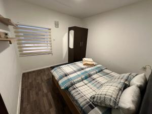 Ліжко або ліжка в номері Apartmani Vučinić