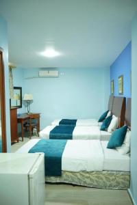 Postel nebo postele na pokoji v ubytování Conord Hotel