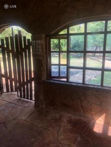 an entrance to a room with windows in a building at Luxury Retreat in Karen Suburb, Nairobi in Nairobi