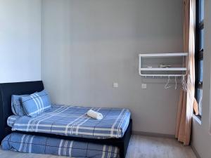 Splendours Condos@Jesselton Quay房間的床