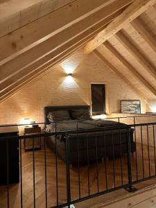a room with a bed in a attic at Ferienhaus am Sommerberg in Vöhrenbach