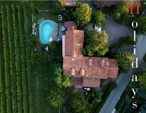 an overhead view of a house with a swimming pool at Tinello San Urbano in Prepotto