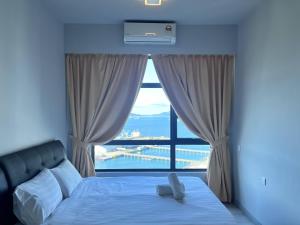 Splendours Condos@Jesselton Quay房間的床