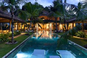 an exterior view of a villa with a swimming pool at Nirbana Retreat in Ahangama