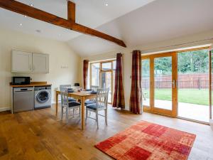 a kitchen and dining room with a table and chairs at 2 Bed in Bishop Auckland 83829 in Wolsingham