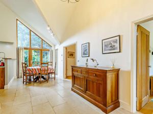 a kitchen and dining room with a table at 3 Bed in Blakeney 83628 in Blakeney