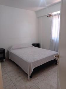 Ένα ή περισσότερα κρεβάτια σε δωμάτιο στο Departamento Viñas de Cuyo