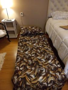 Una cama o camas en una habitación de APART Avenida Corrientes