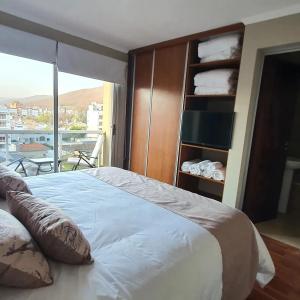 Ένα ή περισσότερα κρεβάτια σε δωμάτιο στο Departamento Caseros Desing