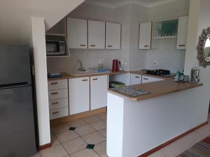 Η κουζίνα ή μικρή κουζίνα στο Leisure Island Apartment