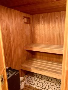 a small wooden sauna with a toilet in it at Nordsee 400 in Wangerooge